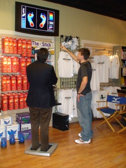 Athletic Shoe Stores Chicago on Runner Picking Out Running Shoes At Running Shoe Store